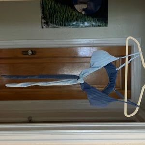 Blue bathinsuit top . Ties in front